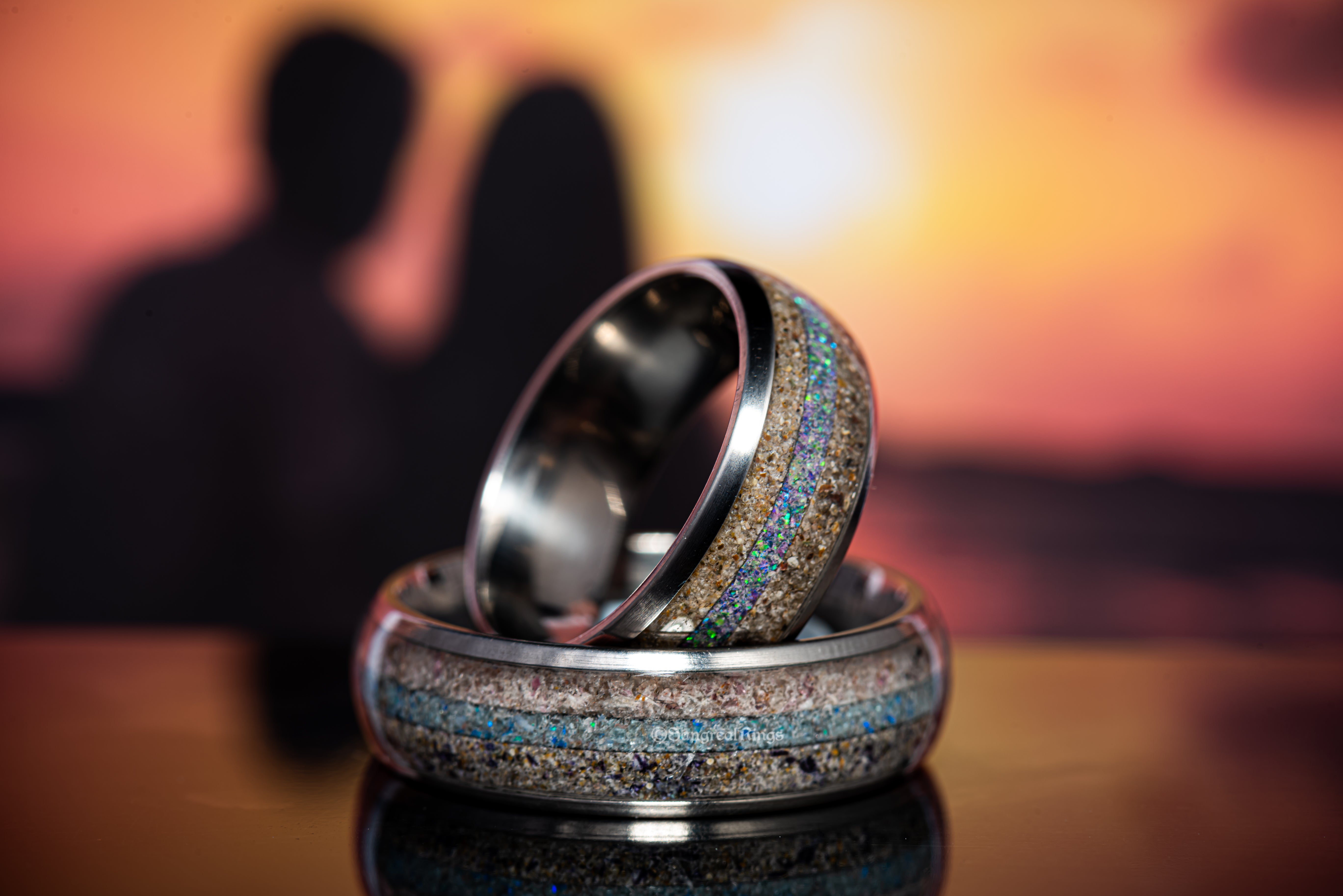 set of rings with a sun set background