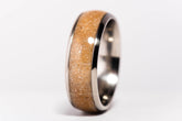 Sangreal Rings custom titanium sand ring with polished titanium edges and textured golden sand inlay closeup