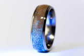 custom titanium sand ring with glittery blue and brown sand inlay and polished dark titanium band by Sangreal Rings