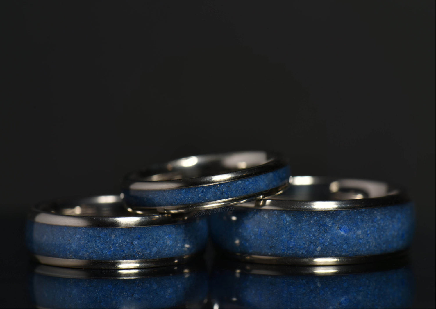 Azurite crystal titanium ring set featuring deep blue azurite inlaid in polished titanium bands