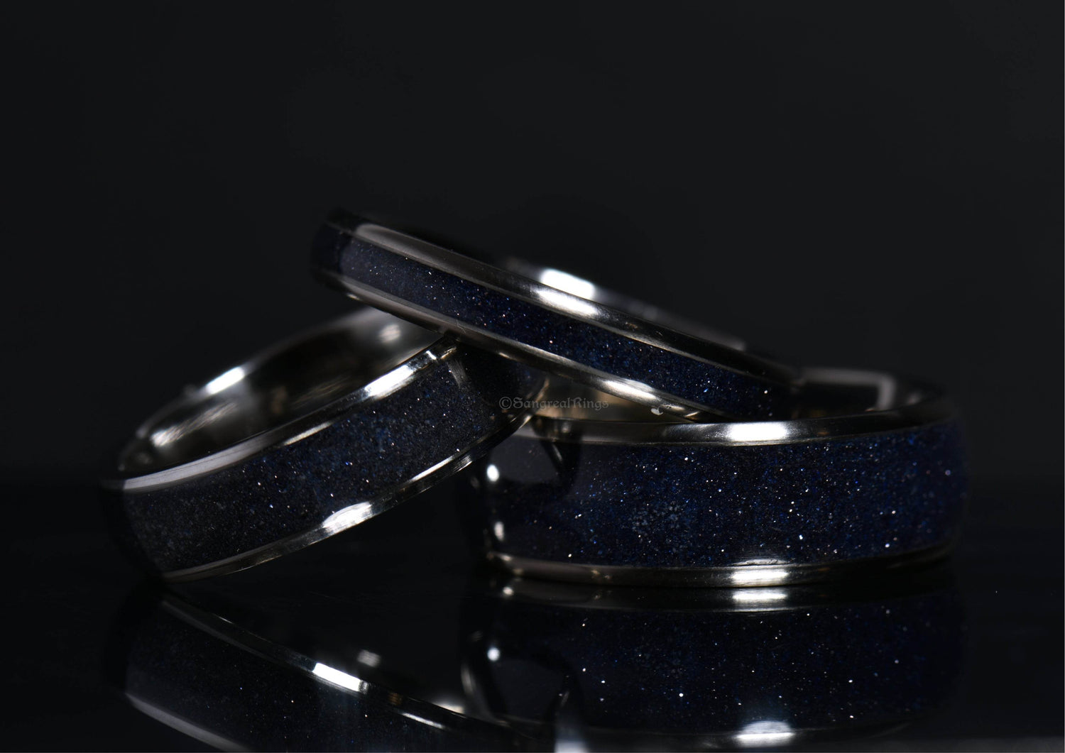 Blue sandstone titanium ring set with shimmering dark blue crystal inlays by Sangreal Rings