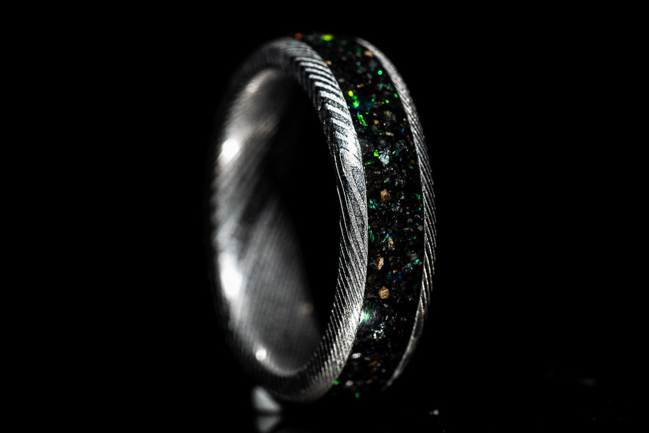 Custom Damascus steel sand inlay wedding band with textured metal and colorful sand detailing