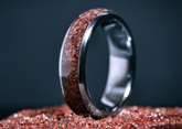 Custom garnet titanium ring from Sangreal Rings with embedded red garnet crystals in a polished titanium band