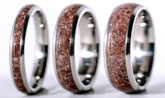 Custom garnet titanium ring by Sangreal Rings with polished silver edges and garnet crystal inlay