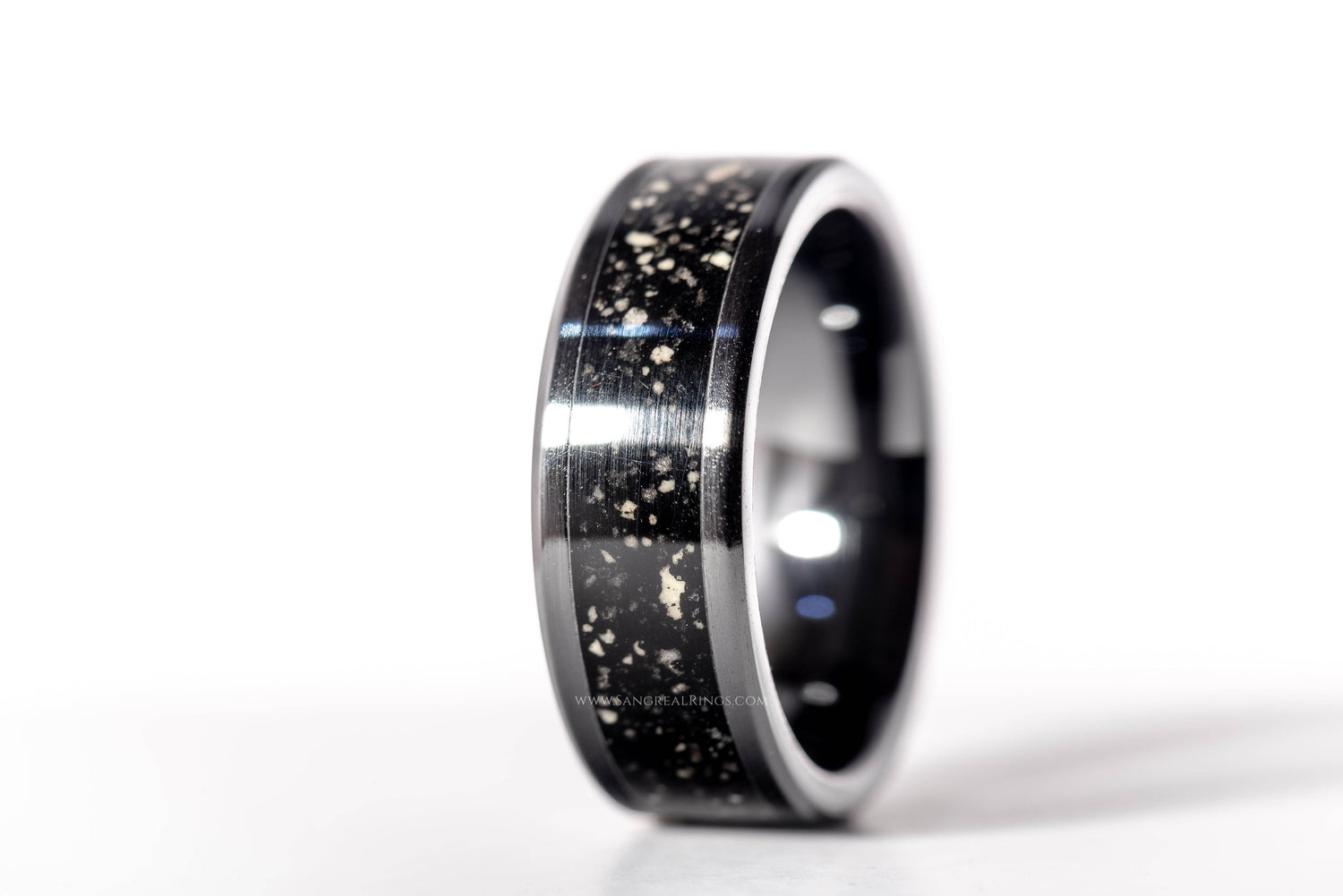 Custom glow in the dark ring by Sangreal Rings with black and silver speckled design