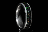 Sangreal Rings custom Damascus steel sand inlay wedding band featuring black green sand inlay and textured Damascus pattern