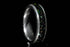Sangreal Rings custom Damascus steel sand inlay wedding band featuring black green sand inlay and textured Damascus pattern