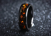 Sleek black onyx and orange opal ring by Sangreal Rings with vibrant orange opal inlay