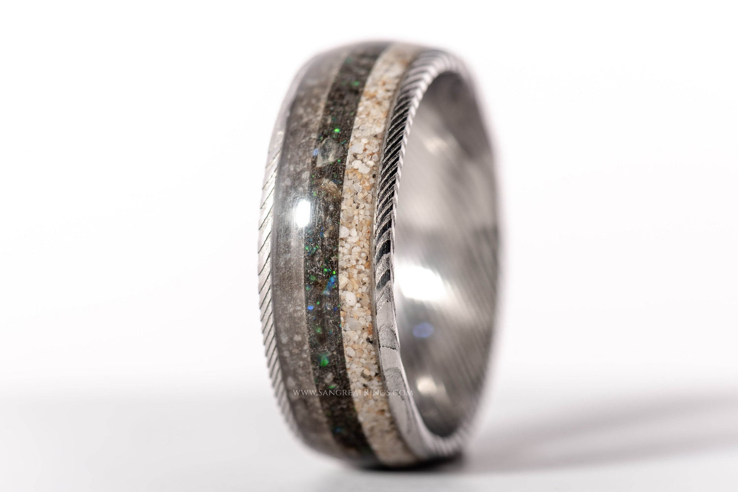 Sangreal Rings Damascus steel sand ring with glitter and natural sand inlays and twisted edge detail