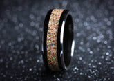 Black ceramic sand ring with a textured sand inlay and glossy black edges from Sangreal Rings