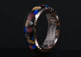Sangrealrings superconductor ring men with multicolor stone inlay and textured metal interior on dark background
