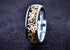 Sangrealrings titanium steampunk ring with gold gear inlay and polished silver edges on black backdrop