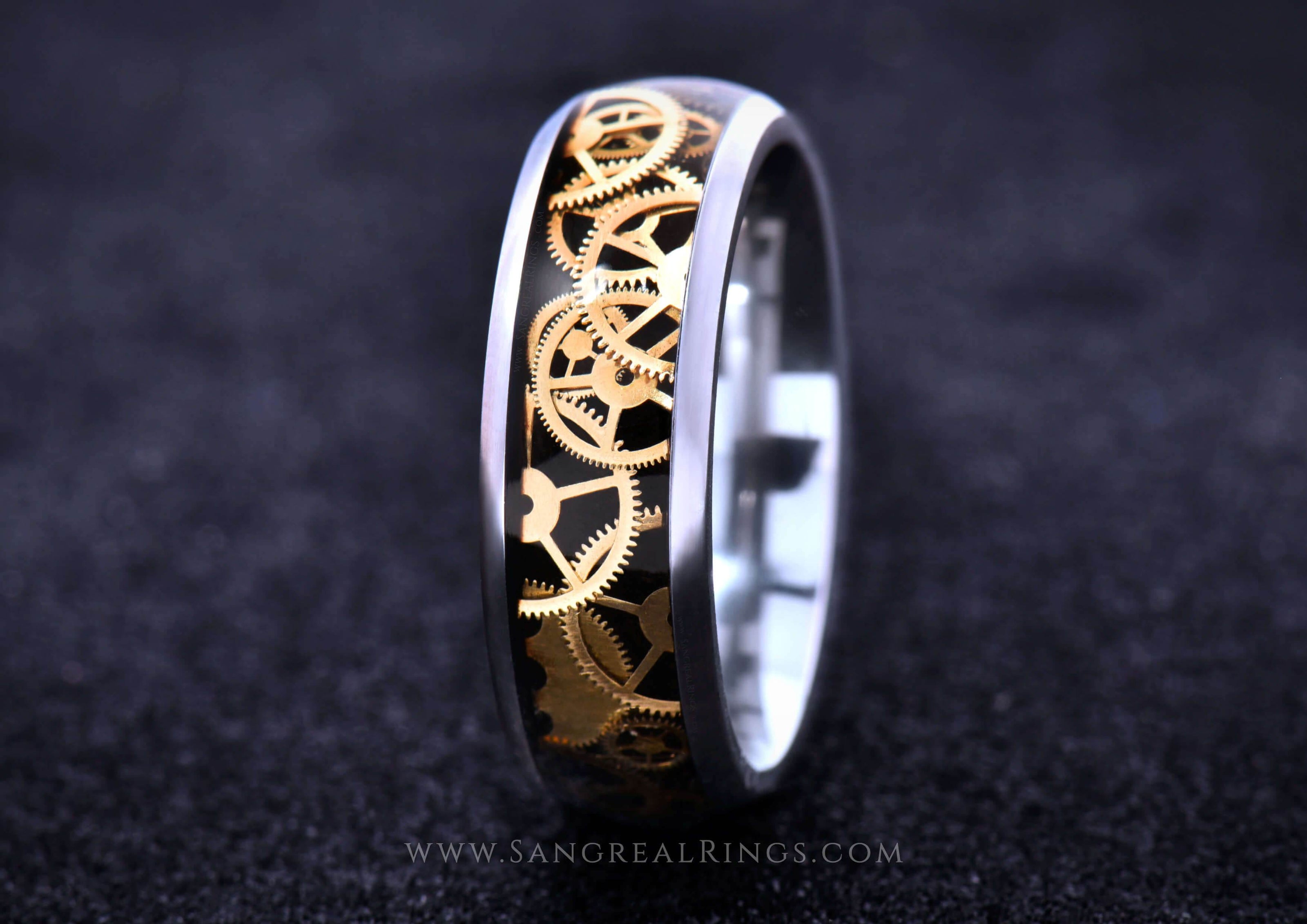 Sangrealrings titanium steampunk ring with gold gear inlay set in black resin and polished edges