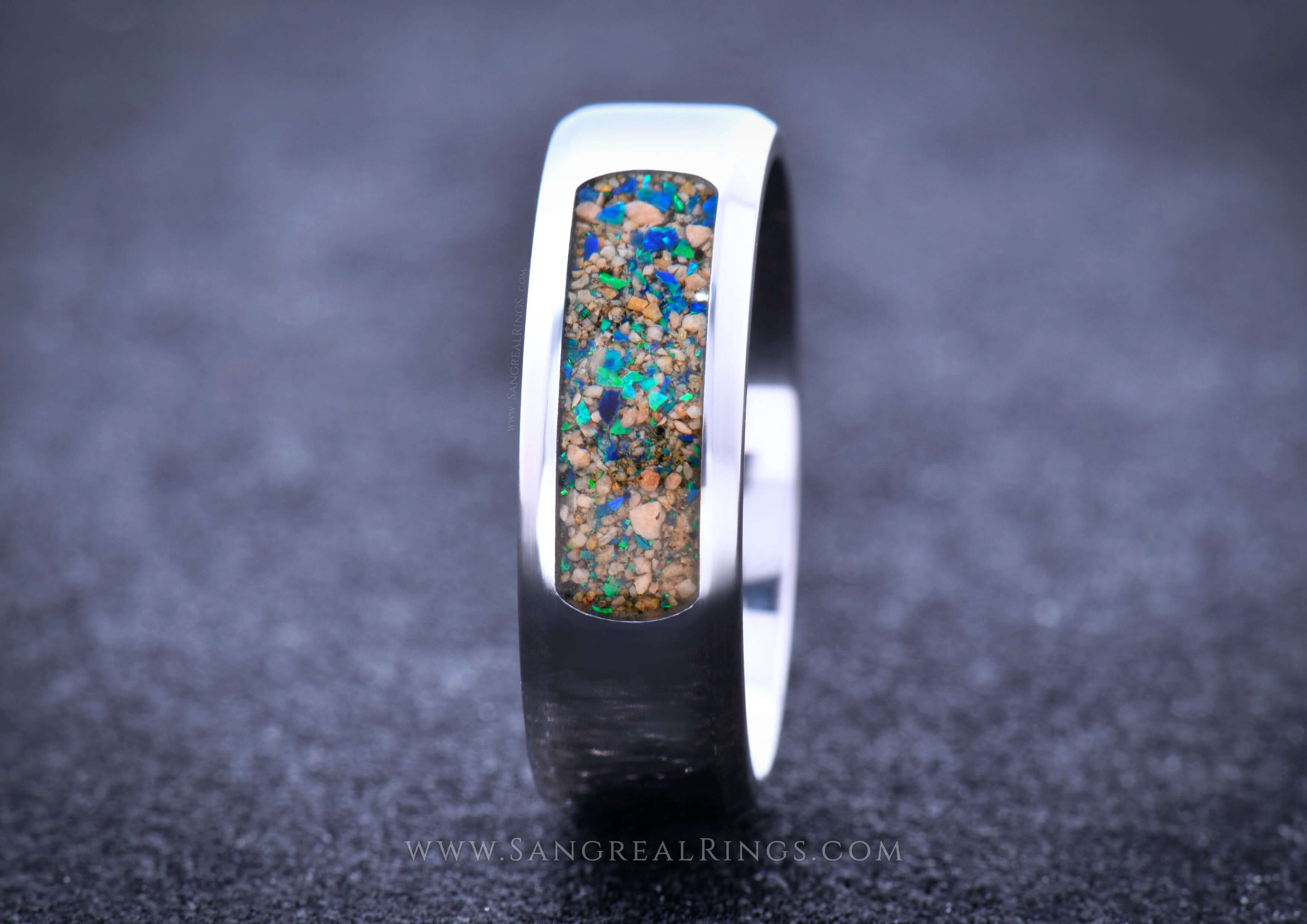 mens titanium wedding ring with custom sand stone and opal inlay 8mm wide