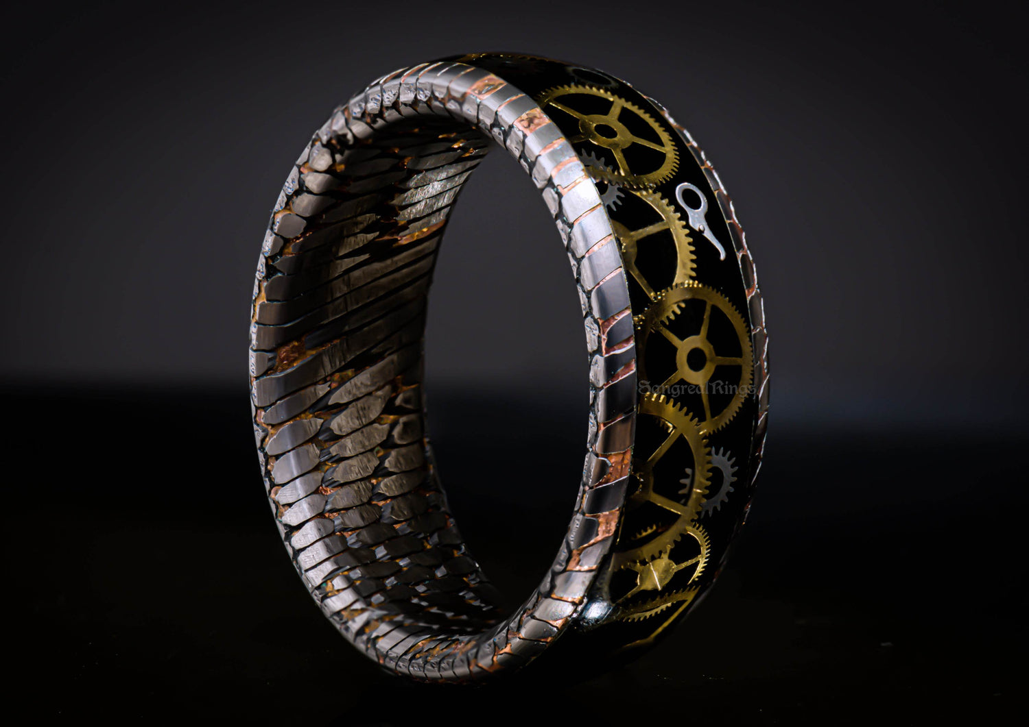 Sangrealrings superconductor steampunk ring featuring intricate gears and a textured metallic band