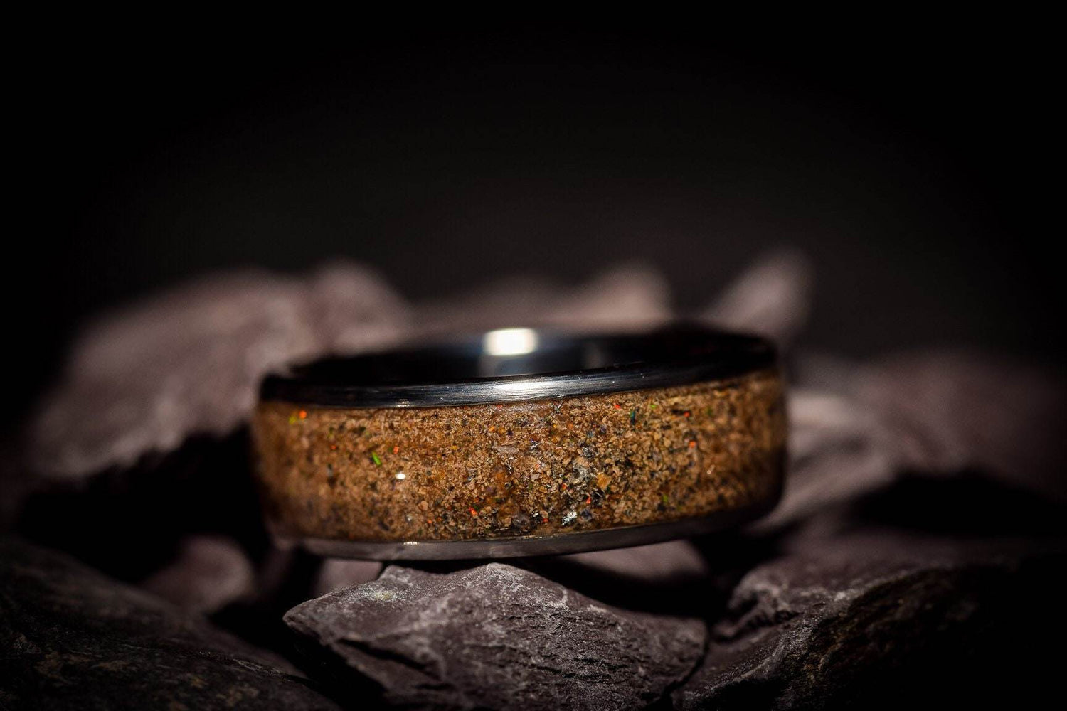 Sangrealrings opal dinosaur bone ring with unique earthy texture on dark background