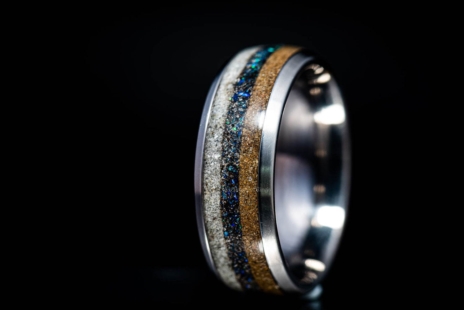 Sangreal Rings titanium sand ring with multicolor sand inlay on silver band close up