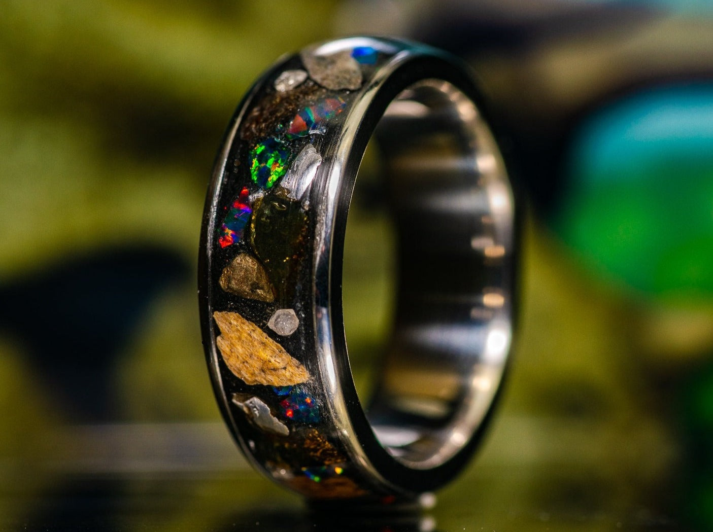 Sangrealrings unique lost world ring with colorful stones and metallic inlay on black band