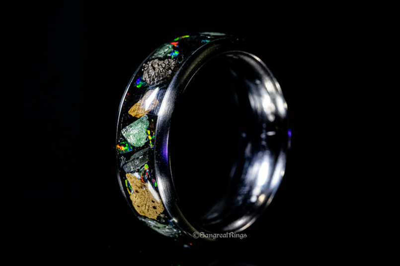 Unique fossil meteorite rings featuring authentic dinosaur bone and meteorite fragments in a polished design