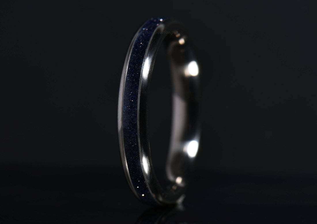 Sangreal Rings blue sandstone titanium ring with dark blue glitter design on black background