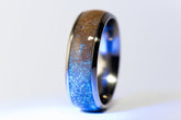 Custom titanium sand ring with a shimmering blue and sand-colored inlay by Sangreal Rings