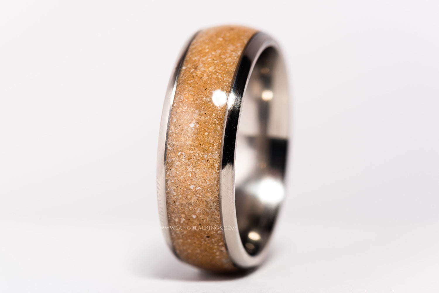 Sangreal Rings custom titanium sand ring with polished silver edges and natural sand inlay