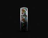 A polished silver band ring featuring an inlay of dark volcanic rock and vibrant, multicolored opal fragments, shown against a solid black background.