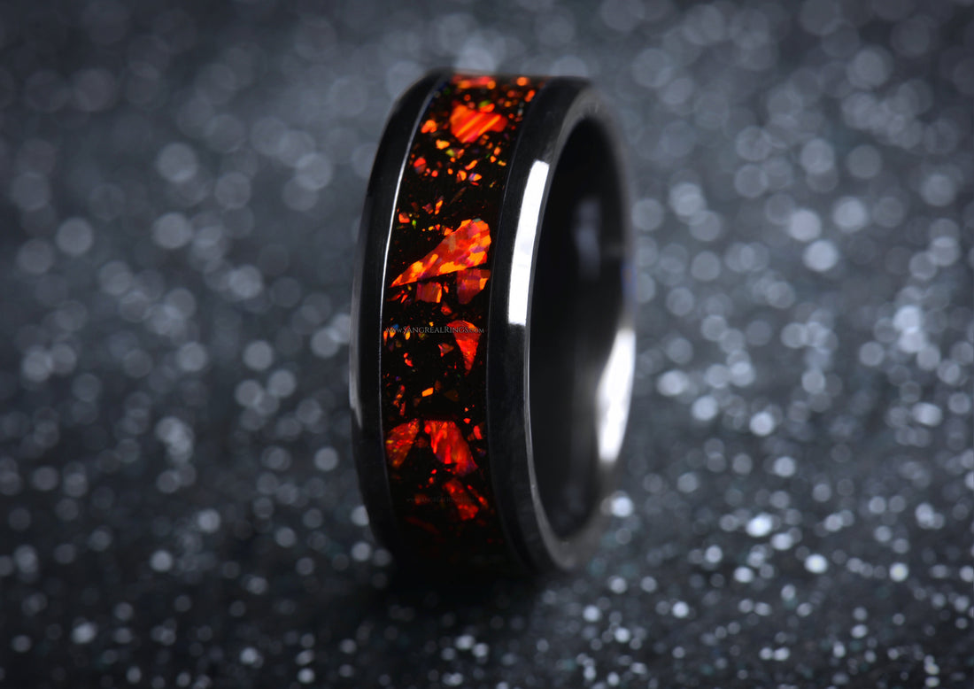 Sleek onyx and red opal ring by Sangreal Rings with vibrant fiery red opal inlay on black band