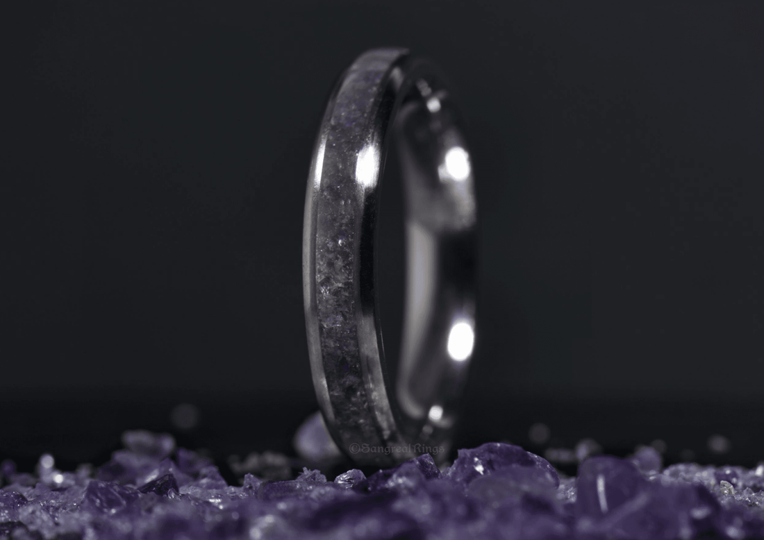 Sangreal Rings amethyst titanium ring with purple crystal inlay on dark background