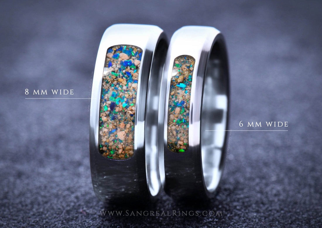 Custom titanium wedding band featuring unique inlaid opal design, available in 8mm and 6mm widths