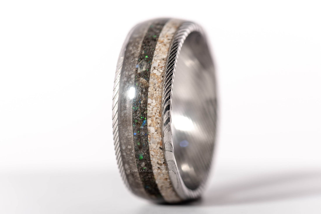 Sangreal Rings Damascus steel sand ring with glitter and natural sand inlays and twisted edge detail