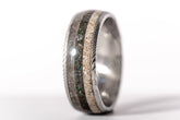 Damascus steel sand ring by Sangreal Rings featuring layered sand and metal details