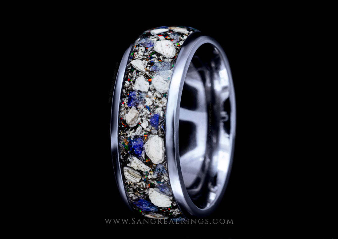 Polished silver metal memorial ring with ashes inlay featuring white shell fragments and blue accents