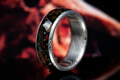 fossil and meteorite ring with diamond shards and opal on a dark background by sangrealrings