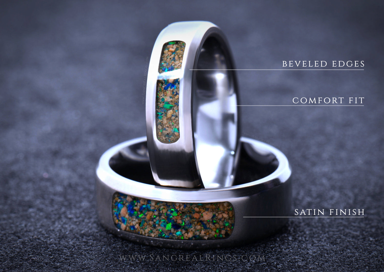 Two titanium wedding rings with embedded stones on a dark background, featuring text labels for design features: beveled edges, comfort fit and satin finish.