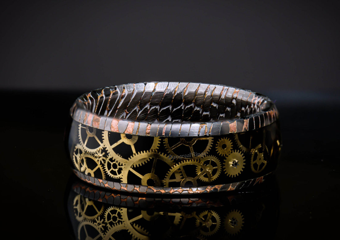 Sangrealrings superconductor steampunk ring with intricate gold gear design and black band